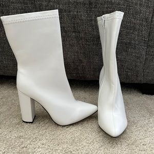 Pristine white mid calf booties. Never Worn!